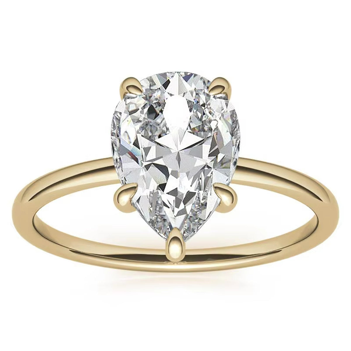 Pear-cut clear-stone solitaire ring with a polished 10K gold band on a white background.