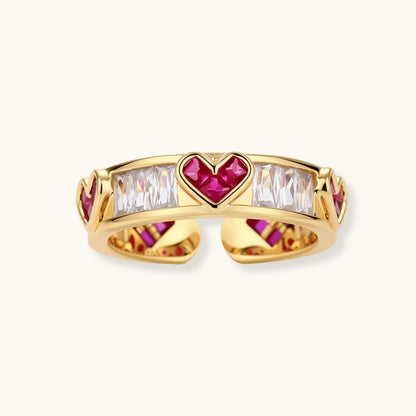 Gold-plated adjustable ring with alternating red heart-shaped and clear rectangular zirconia stones in geometric pattern